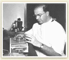 doctor looking at possible skin cancer cells under a microscope