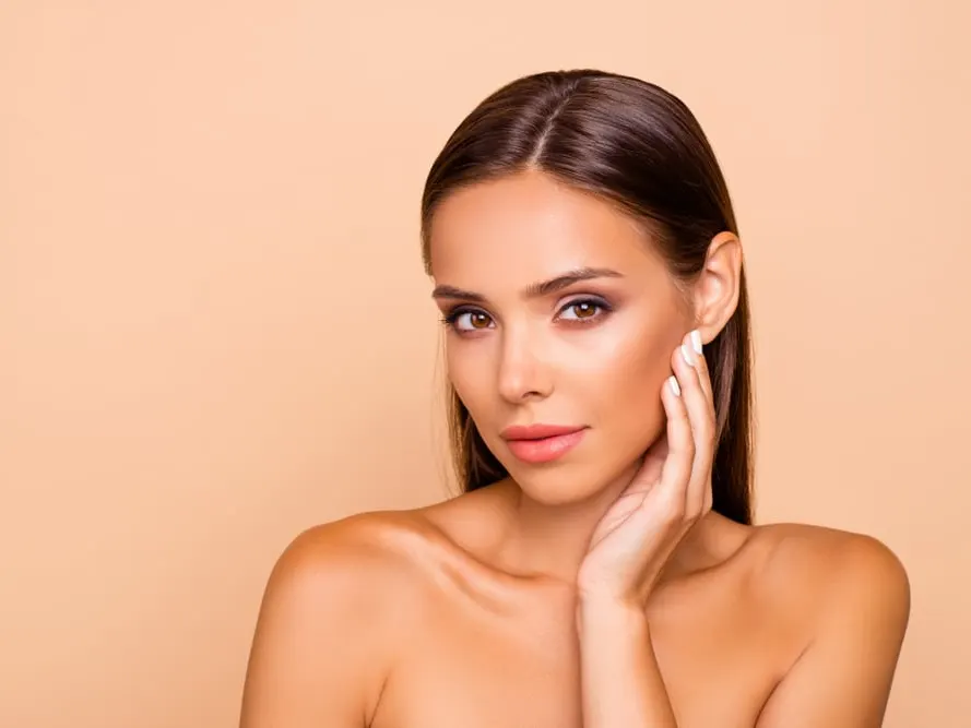 Woman keeping skin protected from harsh winter conditions in Fountain Valley, CA