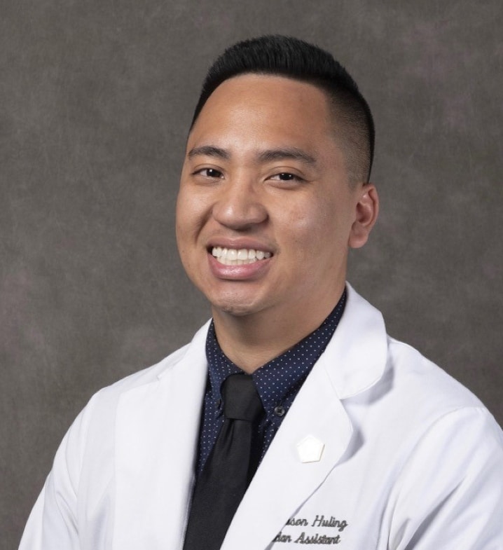 Portrait of Jason Huling, PA-C, smiling in a white coat