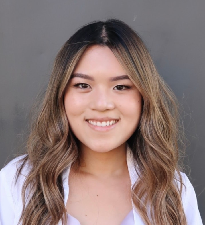Portrait of Teresa Nguyen, PA-C, smiling in a white coat