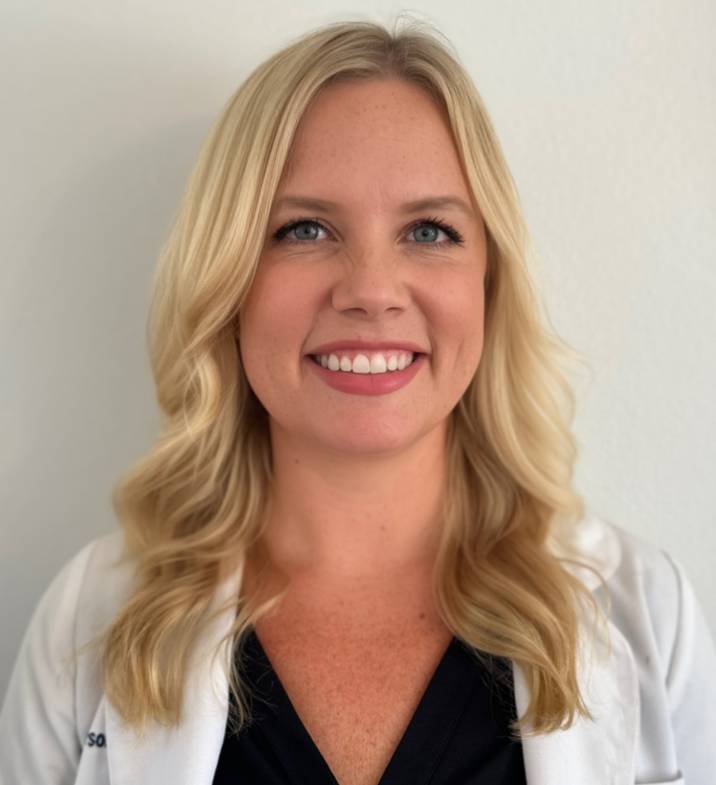 Portrait of Melanie Anderson, PA-C, smiling in a white coat