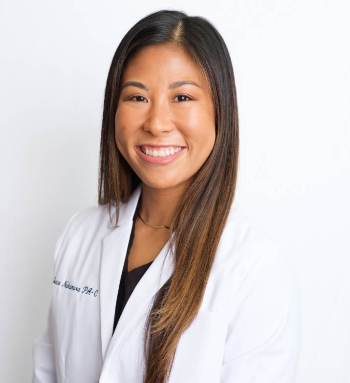 Portrait of Grace Nakamura, PA-C, smiling in a white coat