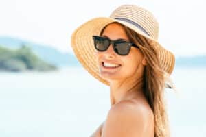 Woman using sun protection in Fountain Valley, CA.